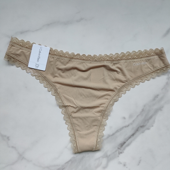 NWT CALVIN KLEIN FLIRTY MICRO THONG PANTY IN DESERT SIZE LARGE - Picture 1 of 5